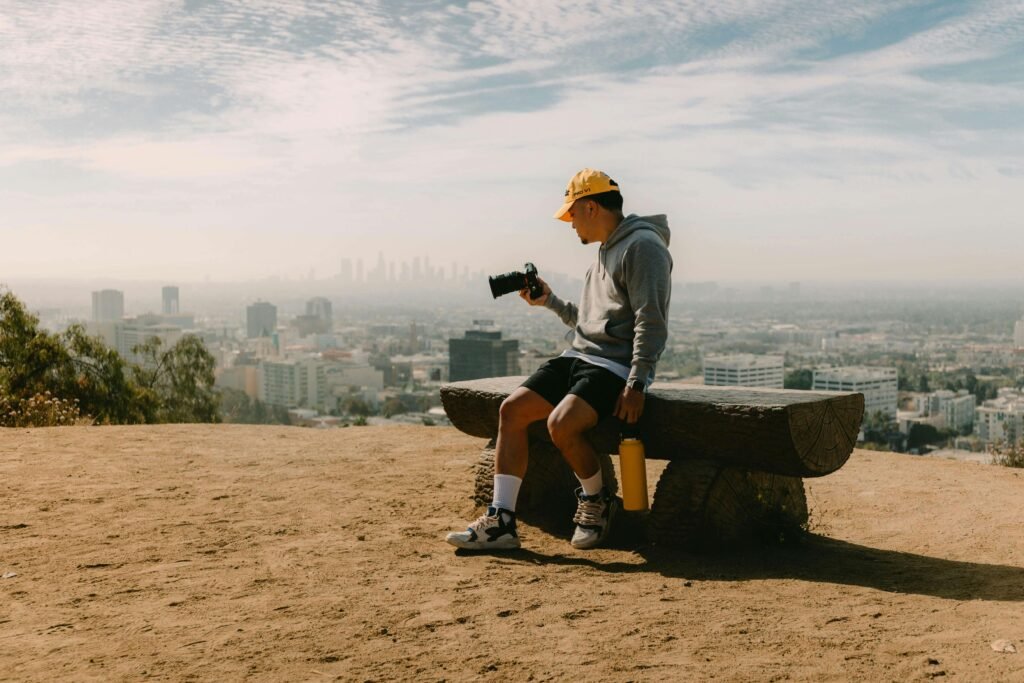 Guy looking at his camera with beautiful Background